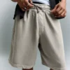 Bermudas com corte largo e estampado – Calções e bermudas – Homem