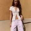 Camisa de manga curta com fecho – Mulher