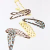 Conjunto de ganchos de cabelo com bolinhas