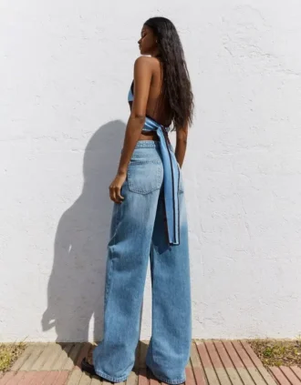Jeans de cintura alta e perna Wide Leg com cintura cruzada – Calças