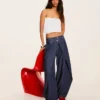 Jeans de cintura baixa com corte balão torcido – Calças