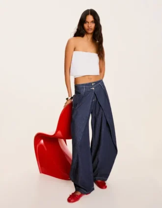 Jeans de cintura baixa com corte balão torcido – Calças