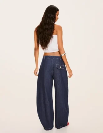 Jeans de cintura baixa com corte balão torcido – Calças