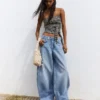 Jeans de cintura baixa e perna Wide Leg com botões à frente – Calças