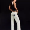 Jeans de ganga largos de cintura baixa com tachas – Calças