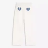Jeans de ganga largos de cintura baixa com tachas – Calças