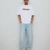 Jeans largos com remendo