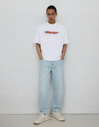 Jeans largos com remendo