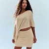 Mini-saia com fio metálico – Mulher
