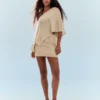 Mini-saia com fio metálico – Mulher