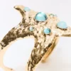 Pulseira tipo manguito com estrela do mar