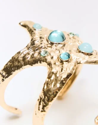 Pulseira tipo manguito com estrela do mar
